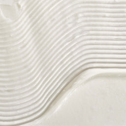 Close-up of a textured white surface with wavy patterns