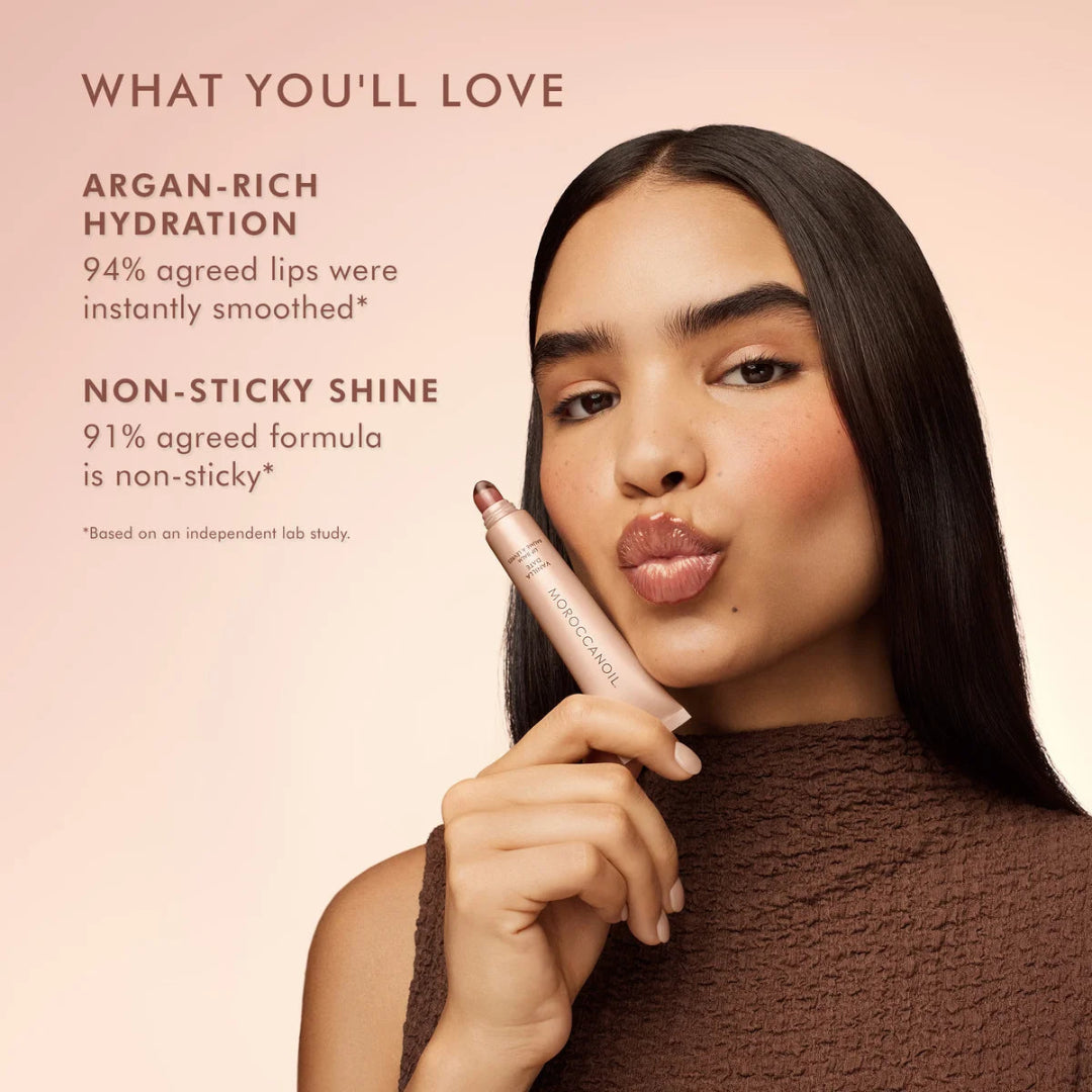 Woman holding a lip product with text about argan-rich hydration and non-sticky shine on a pink background