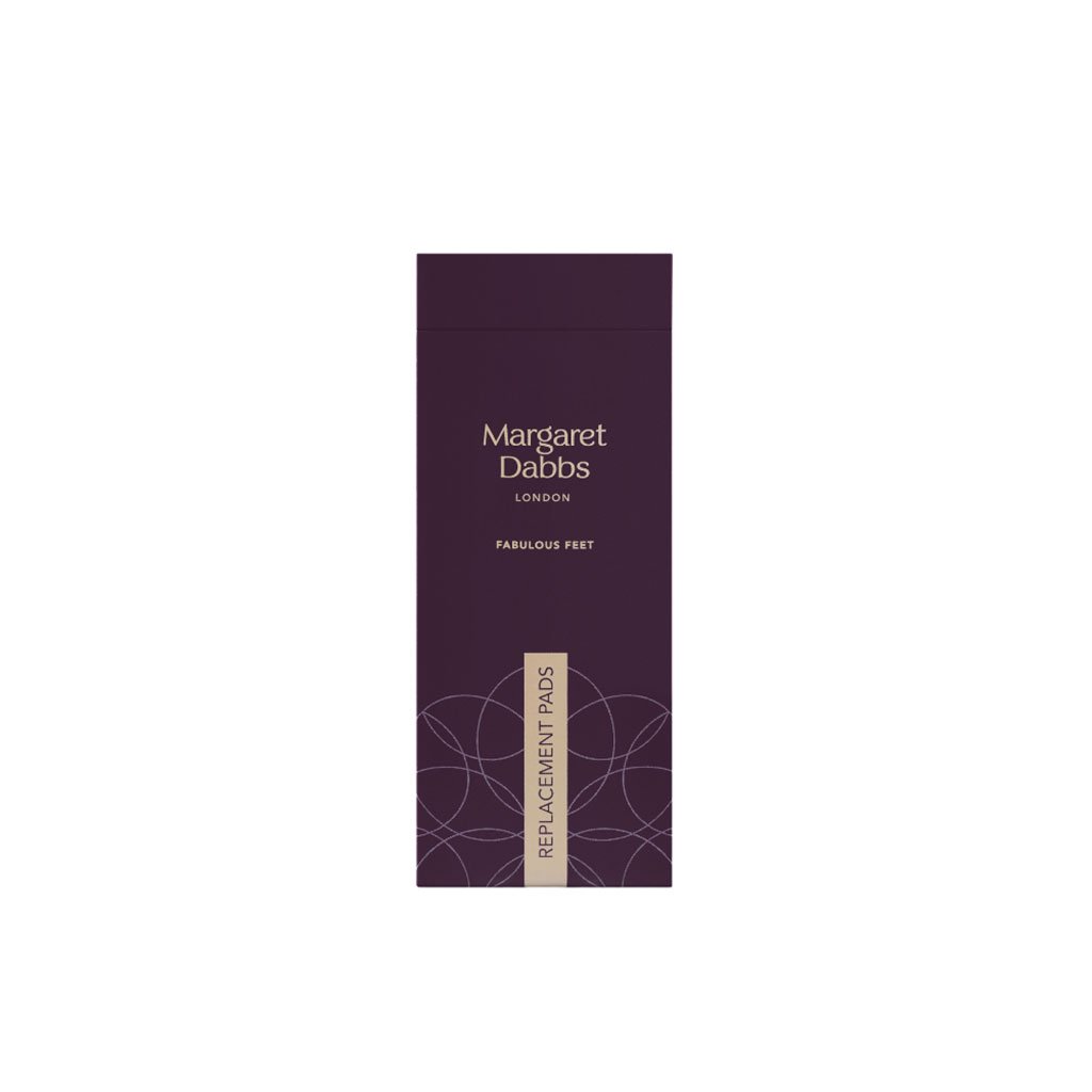 Purple packaging of Margaret Dabbs London replacement pads on a white background