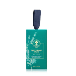 Teal packaging of 'Sweet Dreams Ritual' with a ribbon on a white background