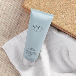 ESPA Fitness Shower Gel laid on a towel 