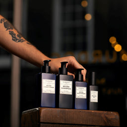 a range of murdock london bottles on a wooden bench